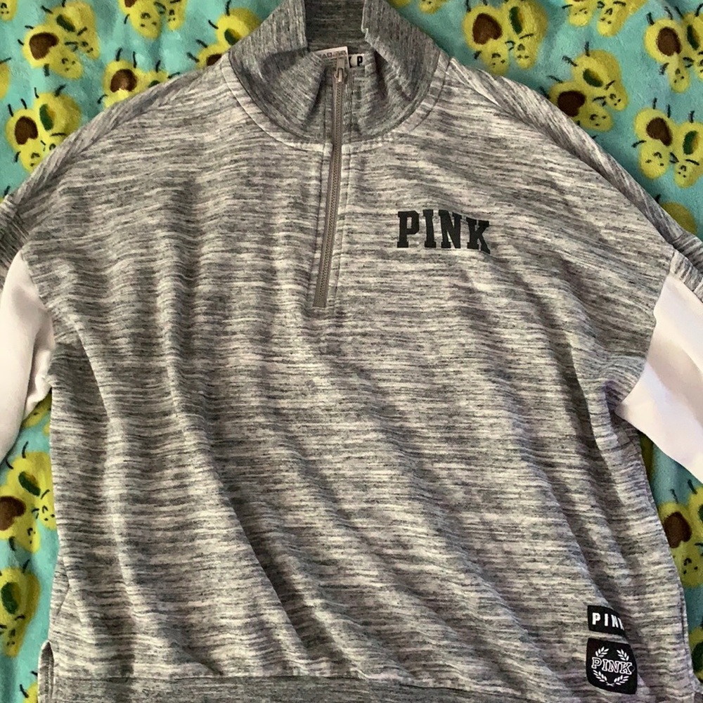 A grey quarter zip hoodie